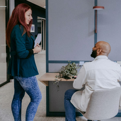 Picture of people communicating in an office environment