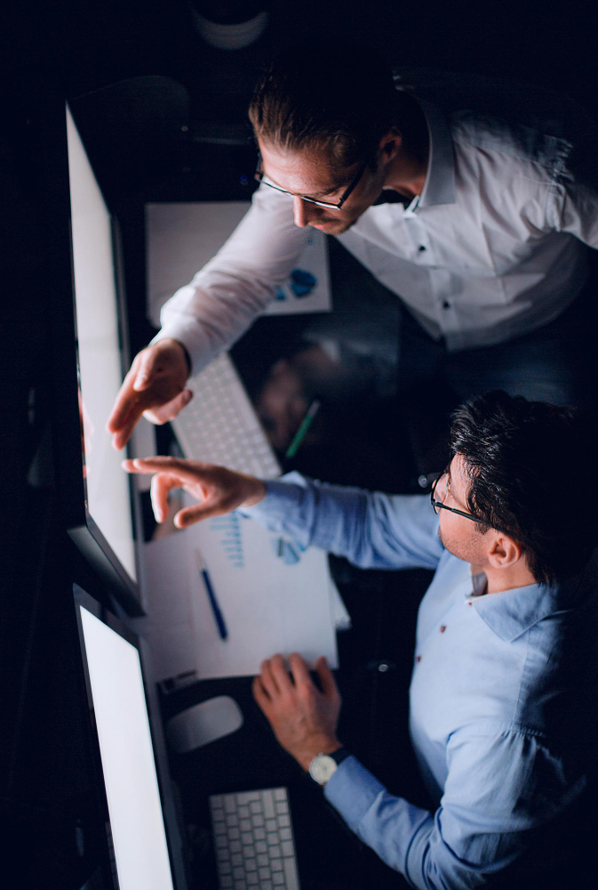 Picture of people talking and working in an office